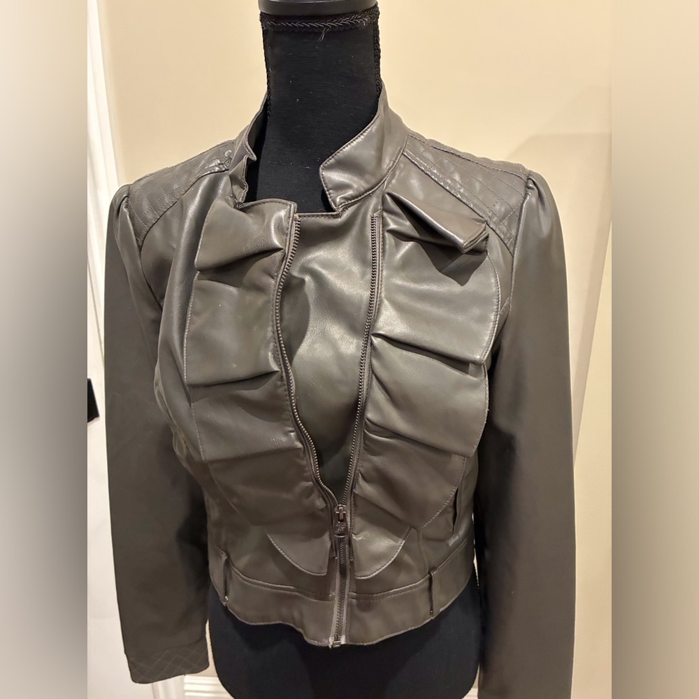 Faux Leather gray moto jacket with ruffle detail.